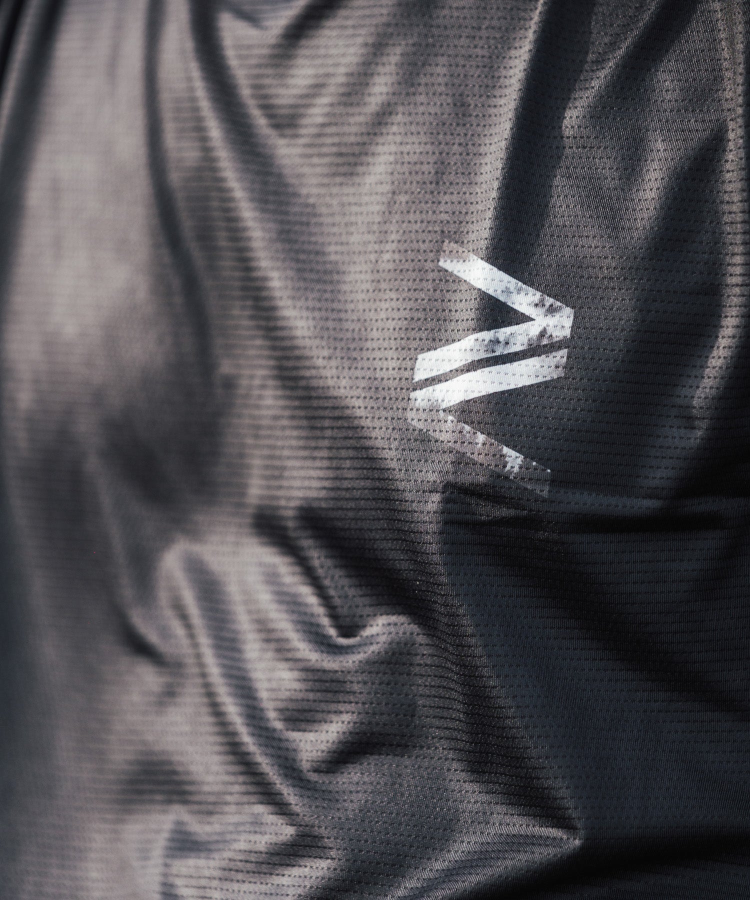detail photo of the mico perforated fabric of our mountain bike jerseys